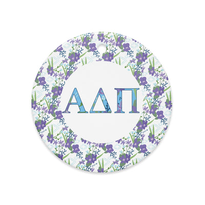 Alpha Delta Pi Holiday ornament shown in full view with filled letters and violet floral accent 