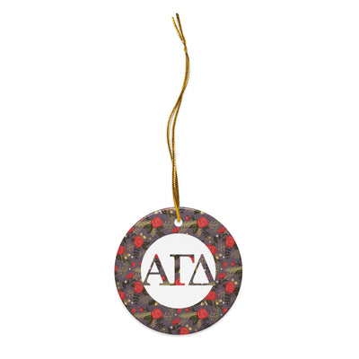 Alpha Gamma Delta Holiday Ornament shown with gold hanging thread featuring filled letters and red rose floral print