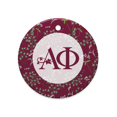 Alpha Phi Holiday Ornament showing Alpha Phi logo and ivy and lily floral print