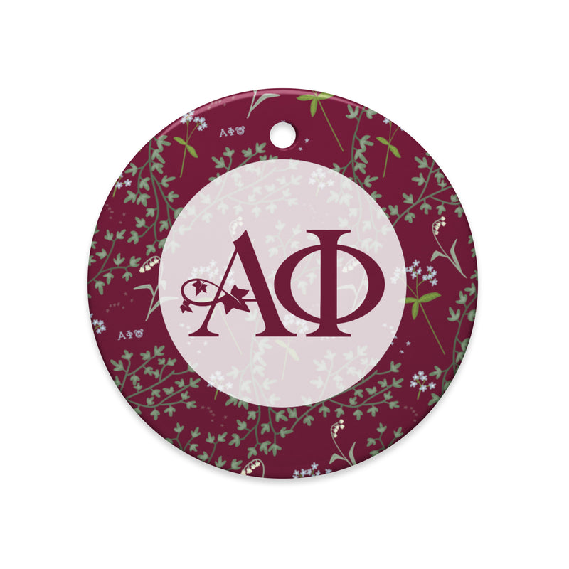 Alpha Phi Holiday Ornament showing Alpha Phi logo and ivy and lily floral print