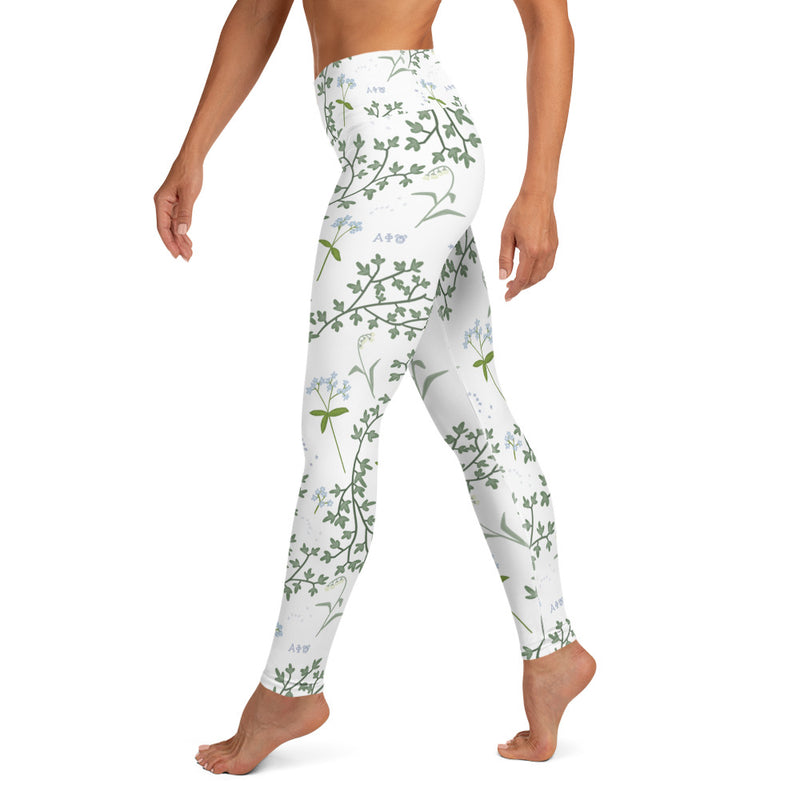 Alpha Phi Sorority Leggings on model walking in side view showing ivy and lily floral print