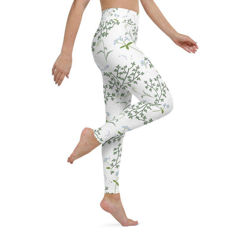 Alpha Phi Sorority Leggings shown on model jumping in side view showing ivy and lily floral print