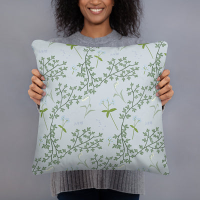 Alpha Phi Letters Sorority Pillow showing signature ivy and lily floral print in model's hands