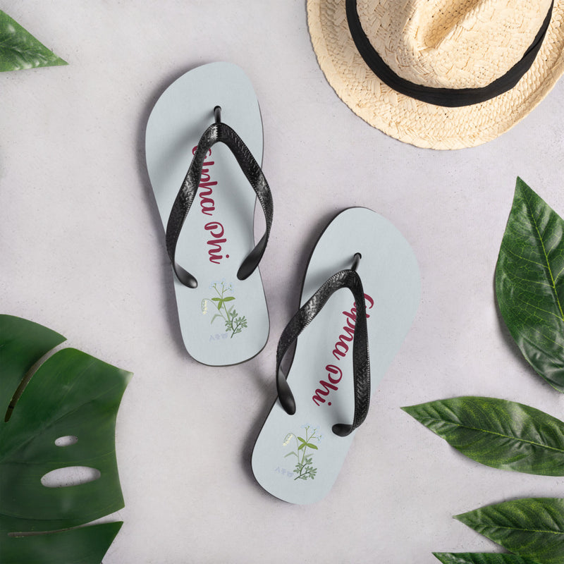 Alpha Phi Silver Blue Flip-Flops in lifestyle setting