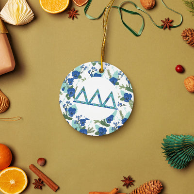 Delta Delta Delta Ceramic holiday ornament shown in lifestyle setting with holiday accents