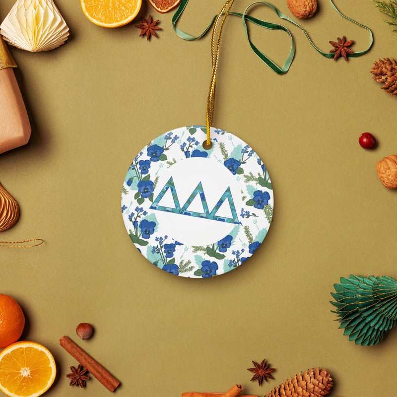 Delta Delta Delta Ceramic holiday ornament shown in lifestyle setting with holiday accents
