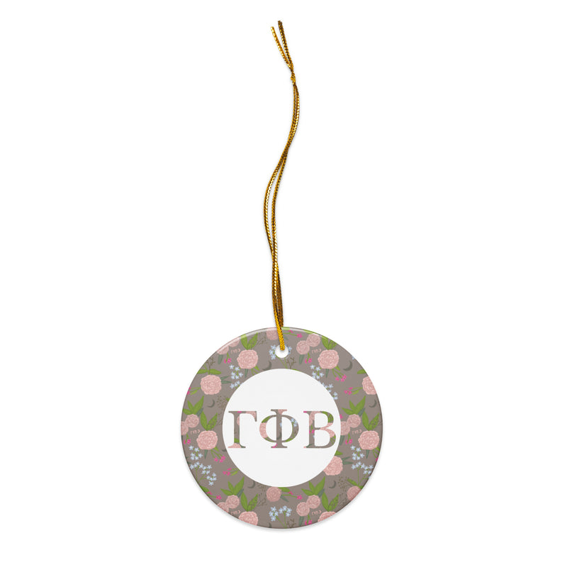 Gamma Phi Beta Ceramic Holiday Ornament shown with gold hanging thread with our filled letters and floral print trim in a la mode
