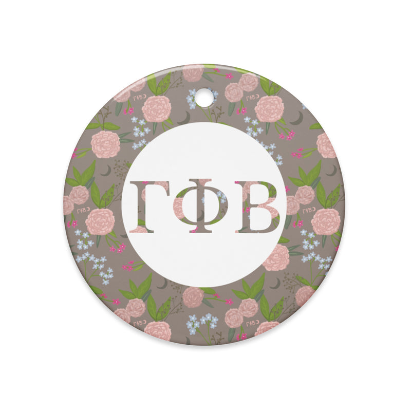 Gamma Phi Beta Ceramic Holiday Ornament shown in full view with our filled letters and floral print trim in a la mode