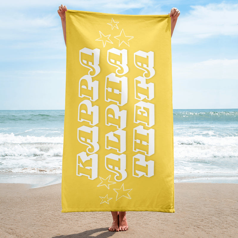 Kappa Alpha Theta Beach Towel held up by model at beach