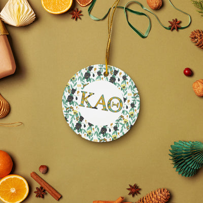 Kappa Alpha Theta Holiday Ornament shown in lifestyle setting with gold thread and filled Theta letters and floral print trim