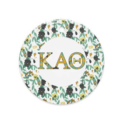Kappa Alpha Theta Holiday Ornament shown in full view with filled Theta letters and floral print trim