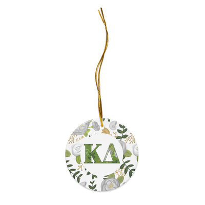 Kappa Delta Holiday Ornament shown with gold hanging thread and filled KD letters with rose floral accent