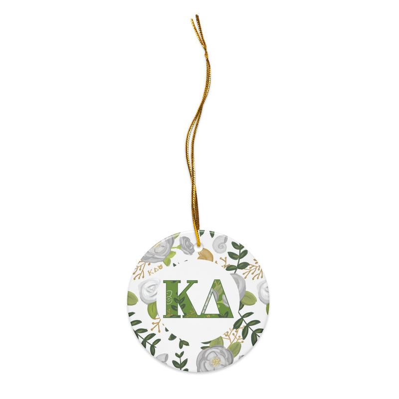 Kappa Delta Holiday Ornament shown with gold hanging thread and filled KD letters with rose floral accent
