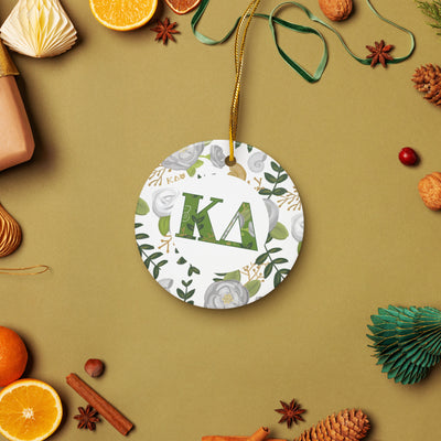 Kappa Delta Holiday Ornament shown with gold hanging thread in holiday lifestyle setting