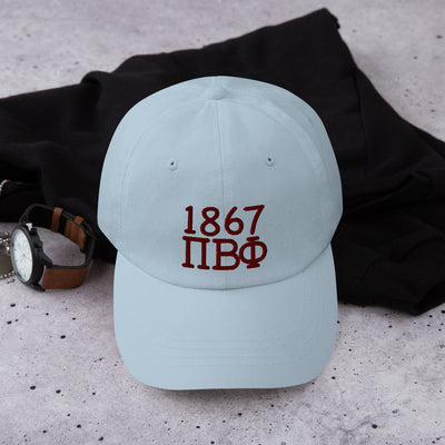 Pi Beta Phi Embroidered Dad Hat in light blue with wine colored embroidery shown in lifestyle setting