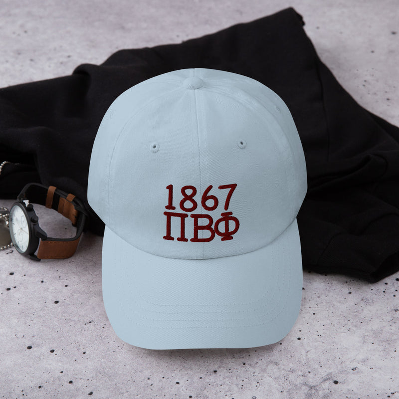 Pi Beta Phi Embroidered Dad Hat in light blue with wine colored embroidery shown in lifestyle setting