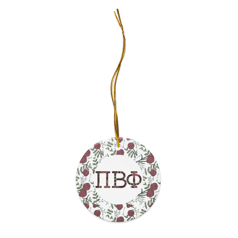 Pi Beta Phi holiday ornament with gold hanging cord with filled letters and carnation floral print