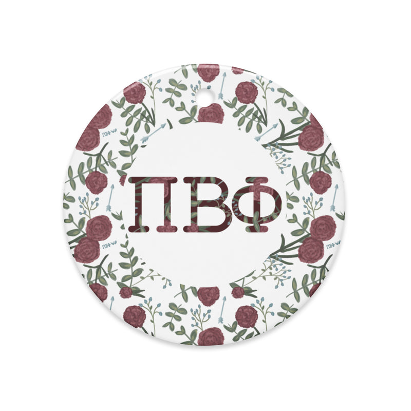 Pi Beta Phi holiday ornament shown in full view with filled letters and carnation floral print
