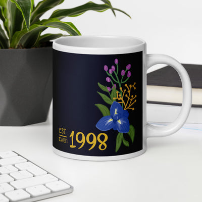 Sigma Alpha Epsilon Pi founding year mug in dark blue with hand-drawn design in lifestyle setting