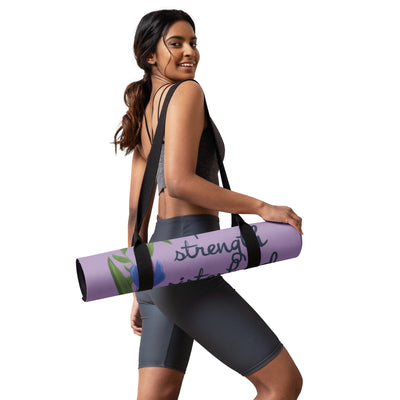 SAEPi motto yoga mat shown in carrier on model's shoulder