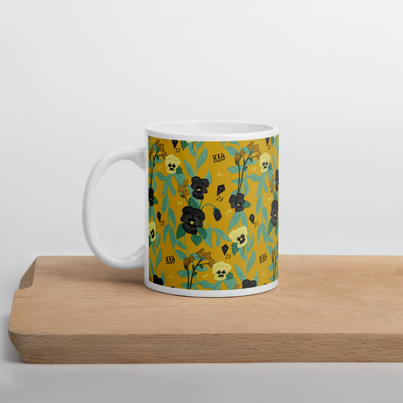 Theta gold floral mug with kite and pansy