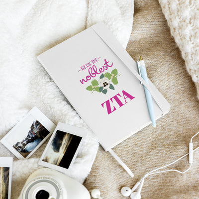Zeta Seek the Noblest Hardcover Journal in white in lifestyle setting