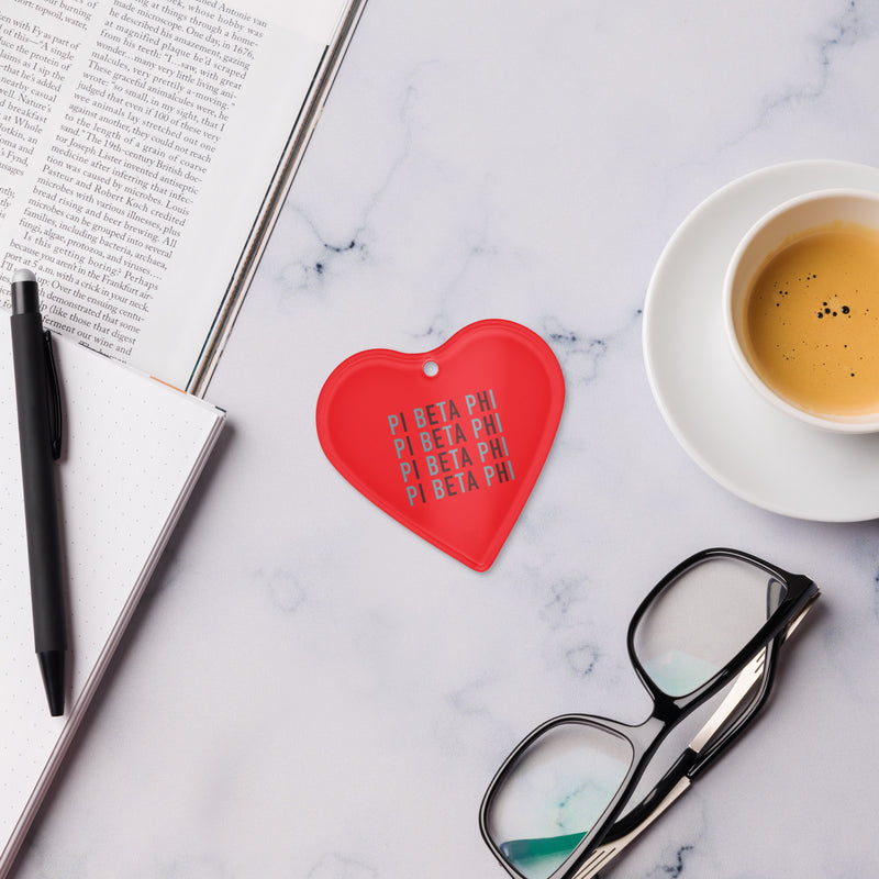 Pi Phi heart shaped ornament in lifestyle setting