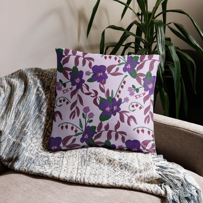 Sigma Kappa Dove Mascot Reversible Pillow showing floral print on back of 22" x 22" size pillow shown on couch