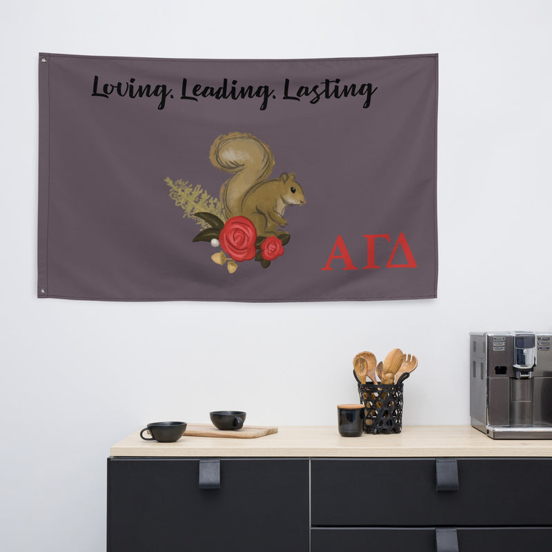 Loving, Leading Lasting Alpha Gam Flag in gray in kitchen area