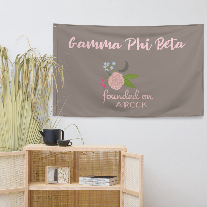 G Phi Founded on a Rock Motto Flag shown with shelf
