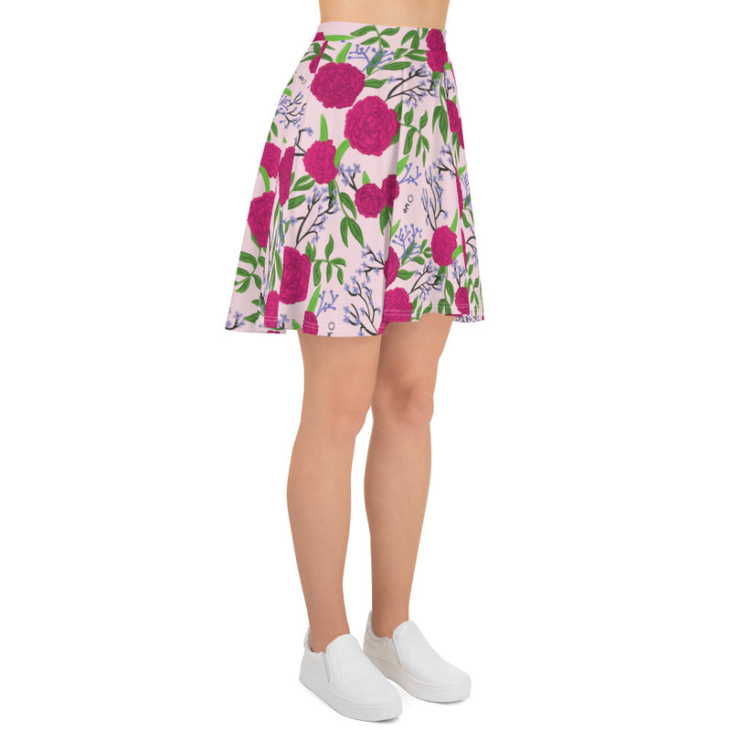 New! Phi Mu Carnation Floral Pink Skater Skirt in right side view on model wearing tennis shoes