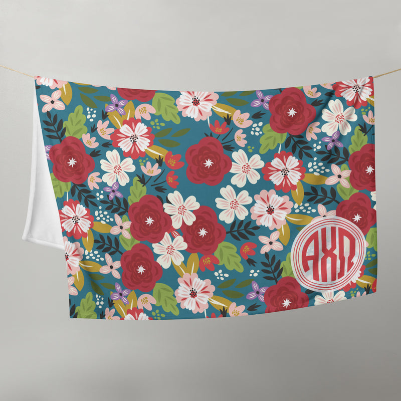 Alpha Chi Omega Modern Floral Blanket on clothesline