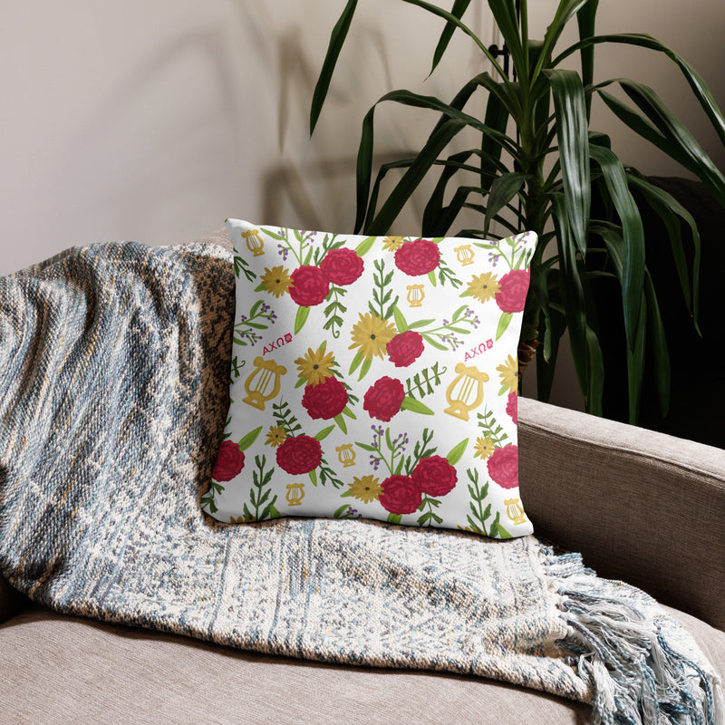 Alpha Chi Omega Colorful Repeat Pillow with floral print on back shown on couch