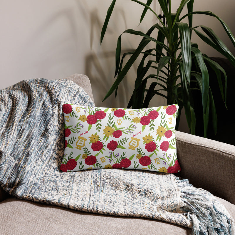 Alpha Chi Omega Colorful Repeat Pillow with floral print on back shown on couch