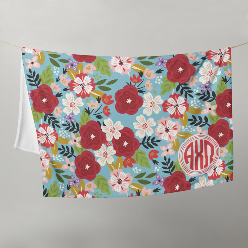 Alpha Chi Omega Modern Floral Blanket on clothesline