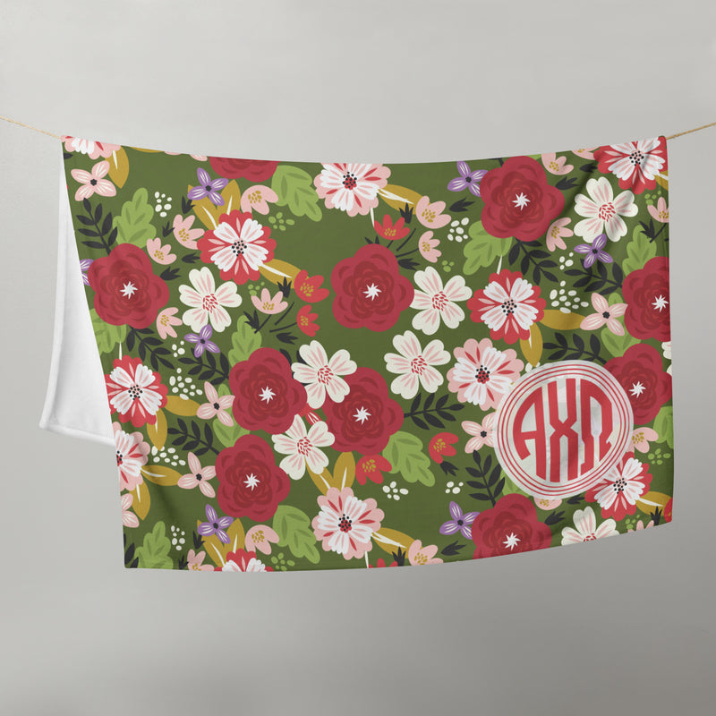 Alpha Chi Omega Throw Blanket in olive green on clothesline