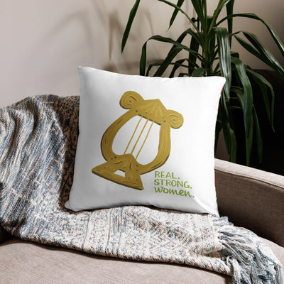 Alpha Chi Real.Strong.Women Pillow in white shown on couch in 22" x 22" lumbar pillow size