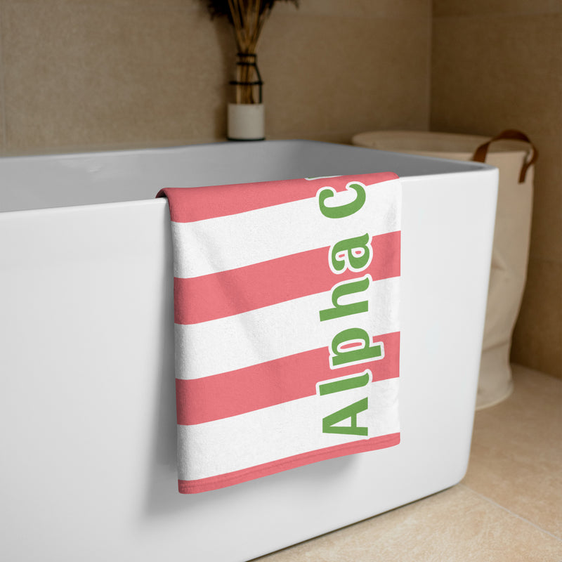 Alpha Chi Striped Cabana Towel shown in bathroom scene