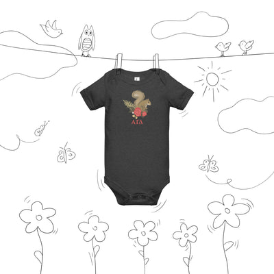Alpha Gamma Delta squirrel baby onesie shown on clothesline drawing in gray