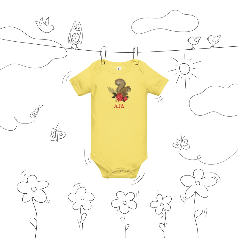 Alpha Gamma Delta squirrel baby onesie shown on clothesline drawing in yellow