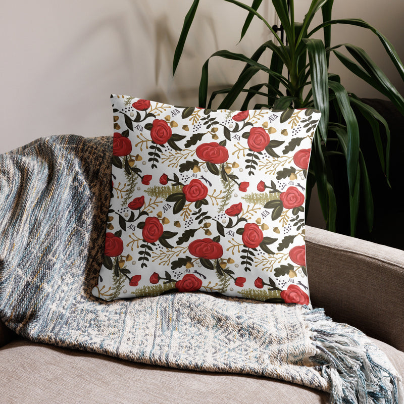 Alpha Gamma Delta Letters Pillow showing rose floral print in white 22 x 22 size on couch