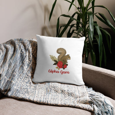 Alpha Gam Squirrel Mascot Pillow in 18 x 18 size in white shown on couch