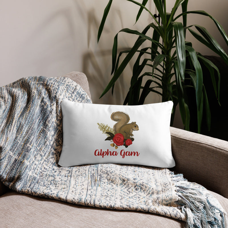 Alpha Gam Squirrel Mascot Pillow in 20 x 12 lumbar pillow size in white shown on couch
