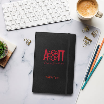 Alpha Omicron Pi Sorority Journal in black in office setting