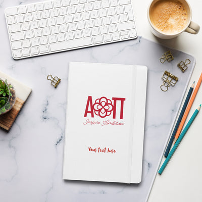 Alpha Omicron Pi Sorority Journal in white in office setting