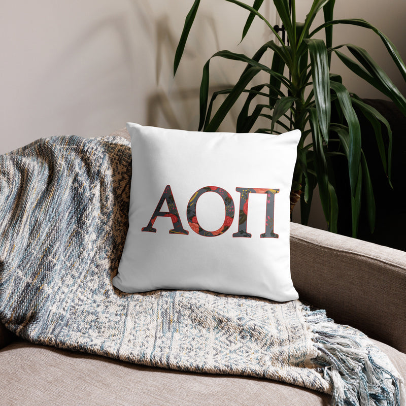 Alpha Omicron Pi Letters Pillow in white in 18 x 18 size shown on couch