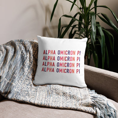 Alpha Omicron Pi Letters Pillow in white showing repeat pattern on back of 18 x 18 size shown on couch