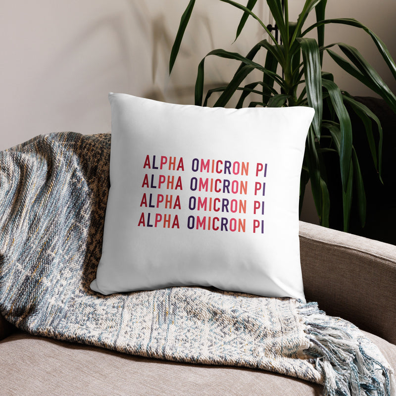 Alpha Omicron Pi Letters Pillow in white showing repeat pattern on back of 22 x 22 size shown on couch
