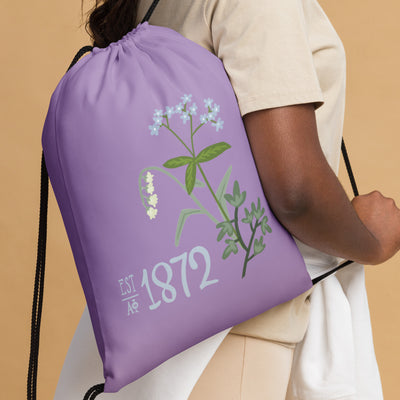 Alpha Phi 1872 Drawstring Bag on model's shoulder 