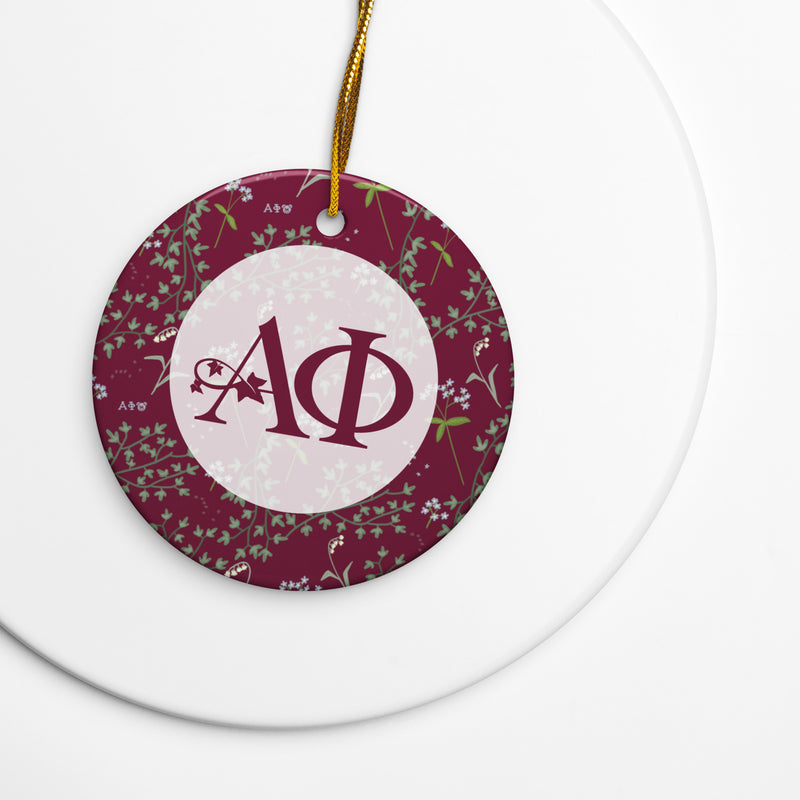 Alpha Phi Holiday ornament with A Phi logo and ivy and lily floral print accents